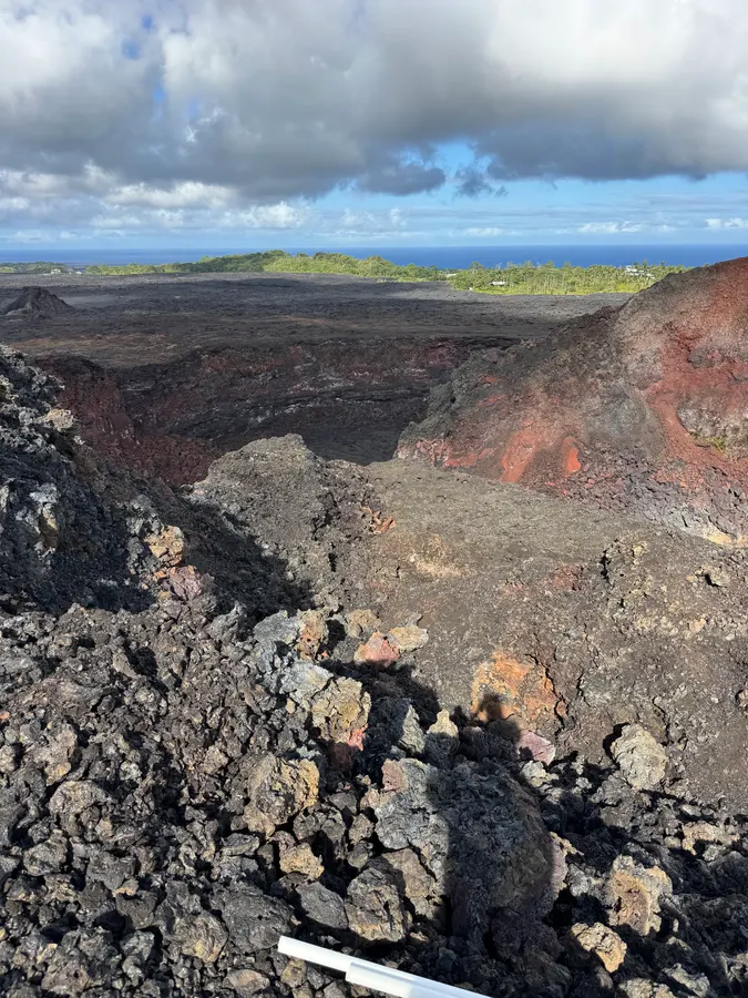 Looking into the collapsed Fissure 8 crater with the Puna coastline beyond