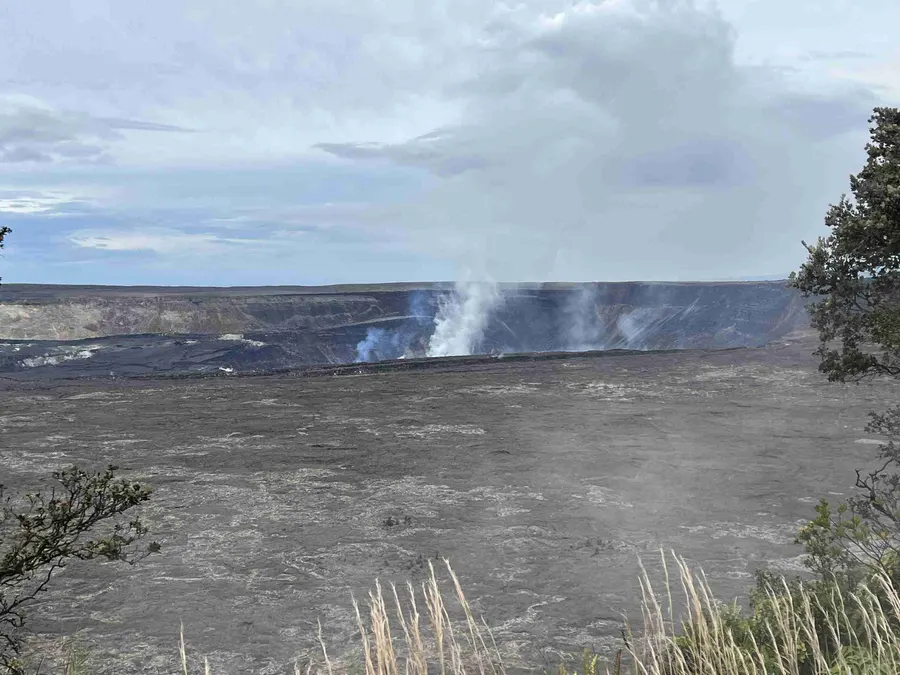 Halemaʻumaʻu crater glowing at dusk